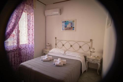 Ένα ή περισσότερα κρεβάτια σε δωμάτιο στο Hotel Ariston