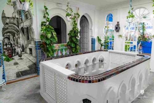 a room with a wall mural of a church at PALACIO AL ANDALUS in Chefchaouene