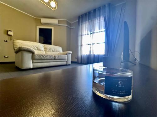 a candle on a table in a living room at Chicco family - Appartamento spazioso per famiglie e soggiorni business - Cinelli Apartment in Vercelli
