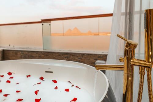 a white chair with red hearts on it at Sultan Pyramids View INN in Cairo