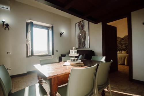 a dining room with a table with a cake on it at Agriturismo Re Tarquinio in Tuscania