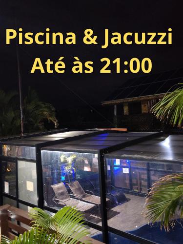 a sign that reads piscina and jaguar ate as with at Hotel Praia Do Rosa in Praia do Rosa