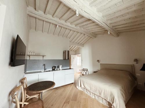 a bedroom with a bed and a sink in it at Villa Sofia in Querceta