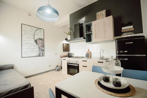 a small kitchen with a table in a room at Agriturismo Re Tarquinio in Tuscania