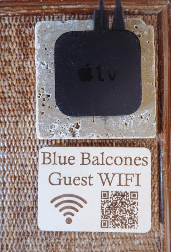 a sign that says blue balances guest wifi at Caribe Rentals in San Juan
