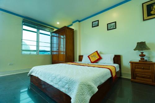 Ένα ή περισσότερα κρεβάτια σε δωμάτιο στο Catba Discovery Hotel