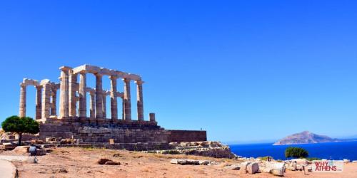 a temple with columns on a hill next to the ocean at Hermes Riviera view in Athens