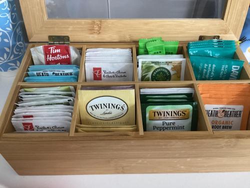 a wooden drawer filled with different types of food at Serenity Inn in Niagara Falls