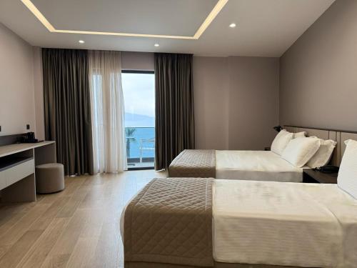 Postel nebo postele na pokoji v ubytování Joelle Premium Hotel