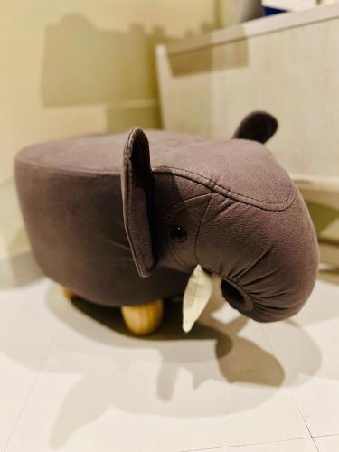 a stuffed elephant sitting on top of a table at Asahi House in Hiyakon