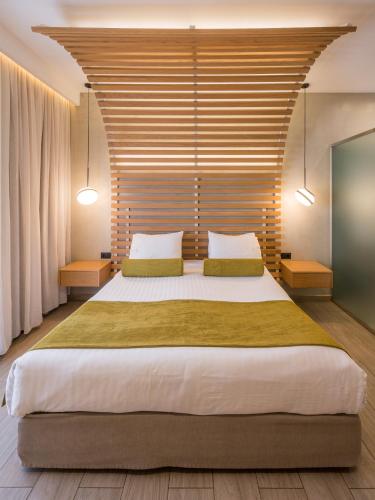 Katil atau katil-katil dalam bilik di Agave Suites
