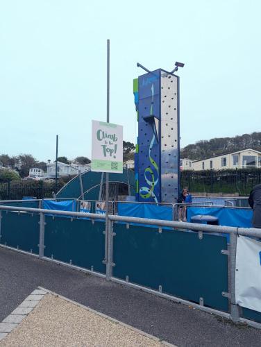 a playground with a sign in front of a building at STYLISH HOLIDAY HOME WITH UNINTERRUPTED VIEWS OF THE FLEET LAGOON ON Haven LITTLESEA HOLIDAY PARK in Wyke Regis