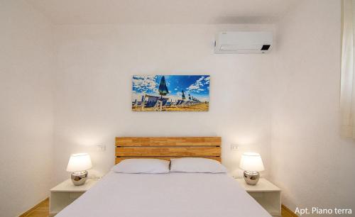 Ένα ή περισσότερα κρεβάτια σε δωμάτιο στο AMAMARE Apartments