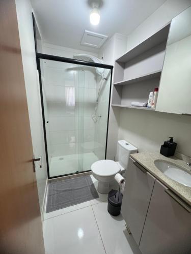 a bathroom with a shower and a toilet and a sink at Apto 202, Torre 1 in Lucas do Rio Verde
