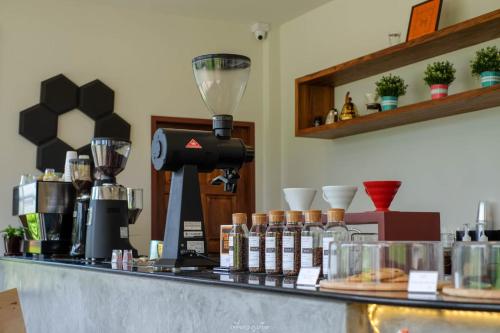 a counter with a coffee maker on top of it at ASAP Boutique Phuket in Ban Thalat Choeng Thale