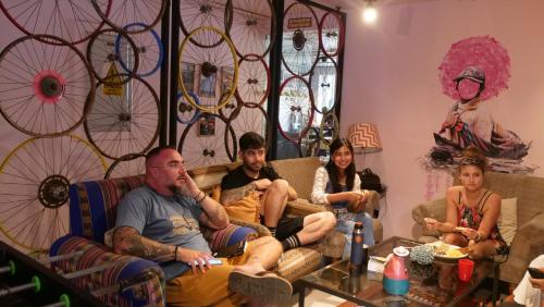 a group of people sitting in a living room at NAIA Miraflores Lima- Formerly Selina Miraflores Lima in Lima
