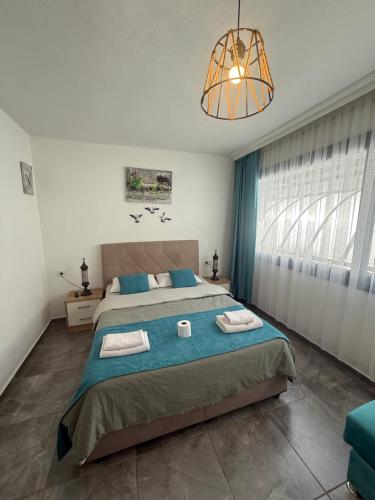 Ένα ή περισσότερα κρεβάτια σε δωμάτιο στο Arslan Homes 1