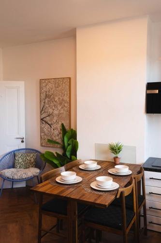 a dining room with a wooden table and chairs at Croke park apartment in Dublin