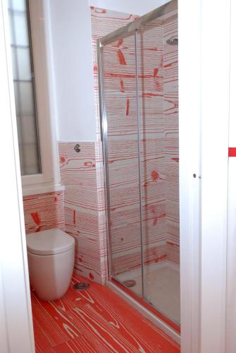 a bathroom with a toilet and a shower at Divine Bed & Breakfast in Rome
