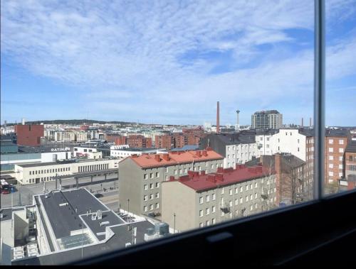 a view of a city from a window at 7th Heaven in Tampere