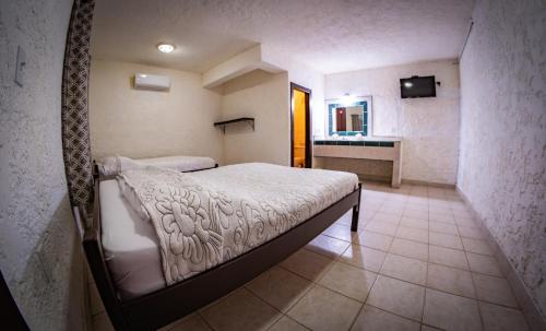 Las Palmas Hotelにあるベッド