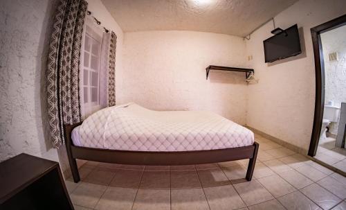 Las Palmas Hotelにあるベッド