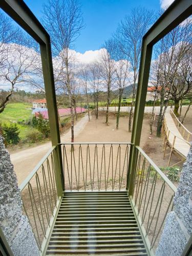 a balcony with a view of a park at Casa da Fonte de Cima in Celorico de Basto