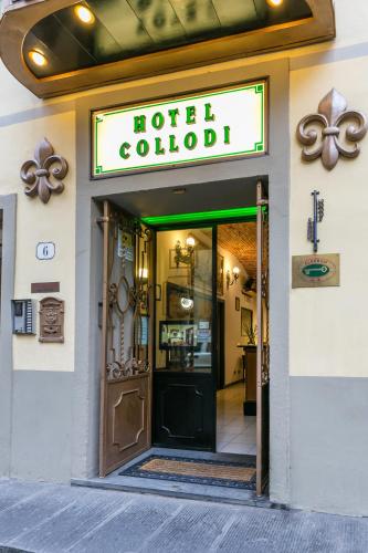 a hotel lobby with a sign over the door at Hotel Collodi Firenze in Florence