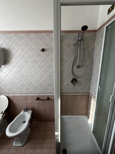 a bathroom with a shower and a toilet and a sink at Le Querce in Montecchio