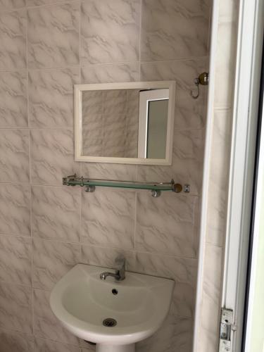 a bathroom with a sink and a mirror at Lenko in Goris