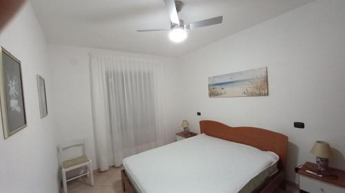 Ένα ή περισσότερα κρεβάτια σε δωμάτιο στο Appartamento GIGLIO CASTELLO 2