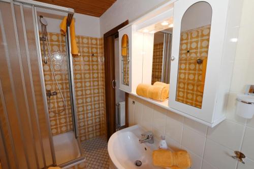 a bathroom with a sink and a shower at Haus-Lily-Nr-03 in Büsum