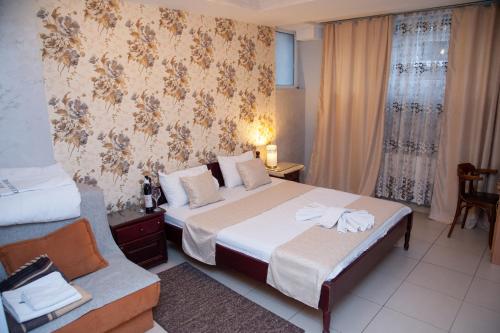 Ένα ή περισσότερα κρεβάτια σε δωμάτιο στο Hotel North City
