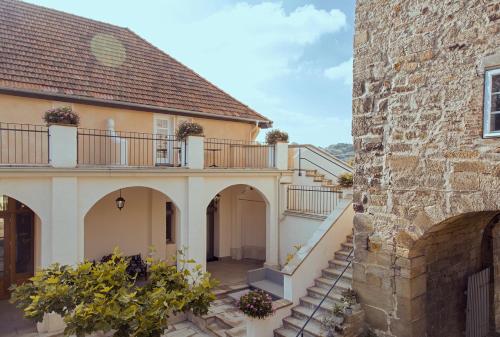 an external view of a house with a balcony at Hotel Bellini in Guxhagen