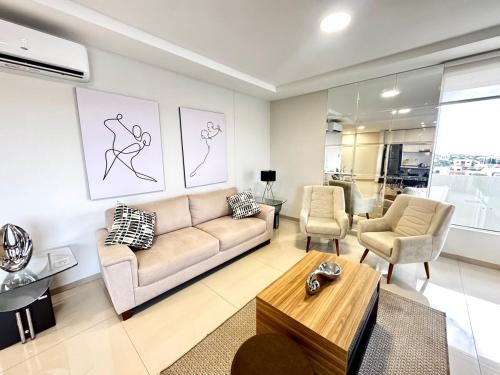 a living room with a couch and two chairs at Luxurious and Spacious Family Apartment in Curupau Isuto in Santa Cruz de la Sierra