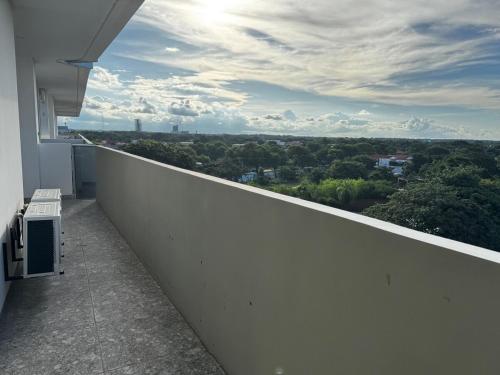 a white balcony with a view of a city at Luxurious and Spacious Family Apartment in Curupau Isuto in Santa Cruz de la Sierra