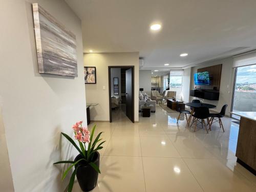 a room with a living room and a dining room at Luxurious and Spacious Family Apartment in Curupau Isuto in Santa Cruz de la Sierra