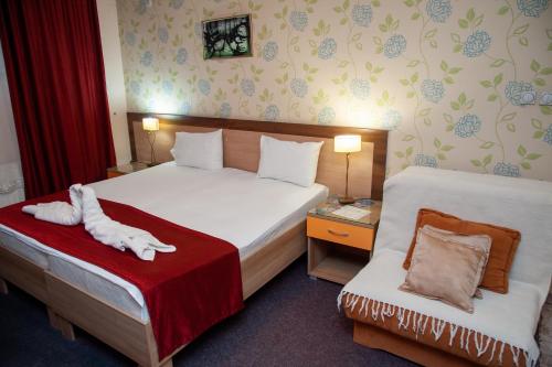 Ένα ή περισσότερα κρεβάτια σε δωμάτιο στο Hotel North City