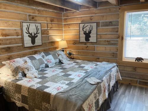 a bedroom with a bed with a teddy bear on it at Stairway to Heaven in Birdseye