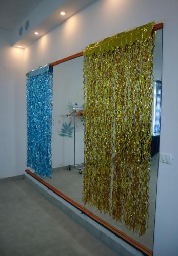 a room with a window with gold and blue curtains at Casa Vacanze Cimorelli in Venafro