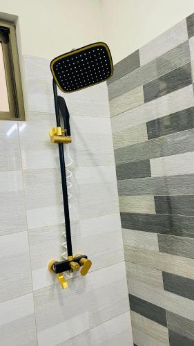 a skateboard rack on the floor in a room at Holiday Guest House Lahore in Lahore