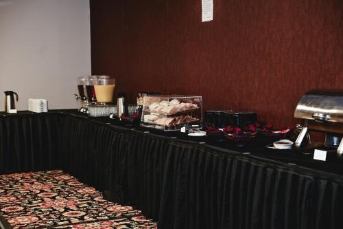 a long black table with food on it at Quality Hotel & Conference Centre in Peace River