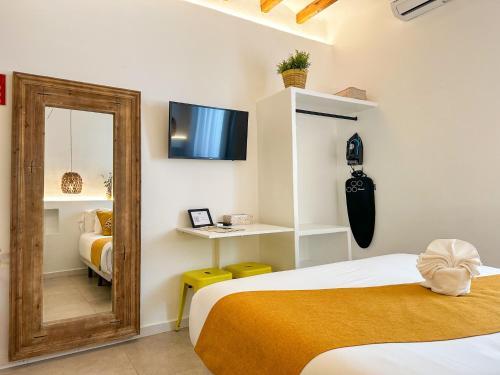 Ένα ή περισσότερα κρεβάτια σε δωμάτιο στο Moona Hostal Altea