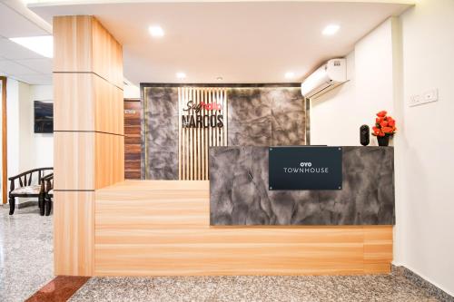 an office lobby with a sign on the wall at Super Collection O Sayhallo Narcos in Bhubaneshwar