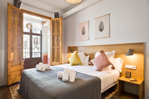 Postel nebo postele na pokoji v ubytování Central Apartments Barcelona