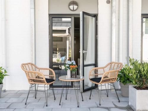 two chairs and a table on a patio at Studio with Terrace in Sölvesborg in Sölvesborg