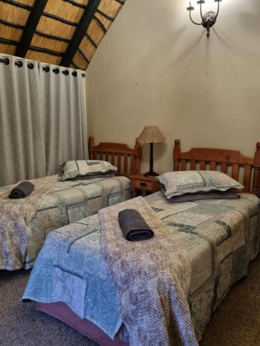 Ένα ή περισσότερα κρεβάτια σε δωμάτιο στο Kudu Crescent Guesthouse