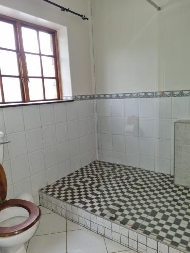 Ένα μπάνιο στο Kudu Crescent Guesthouse