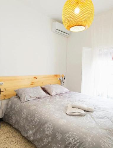 Ένα ή περισσότερα κρεβάτια σε δωμάτιο στο Apartamento EL CARPIO CENTRO WiFi