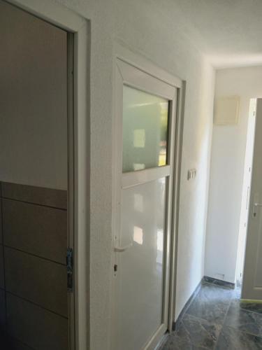an open door in a room with a hallway at Log Cabins Jovicic in Bosanska Dubica